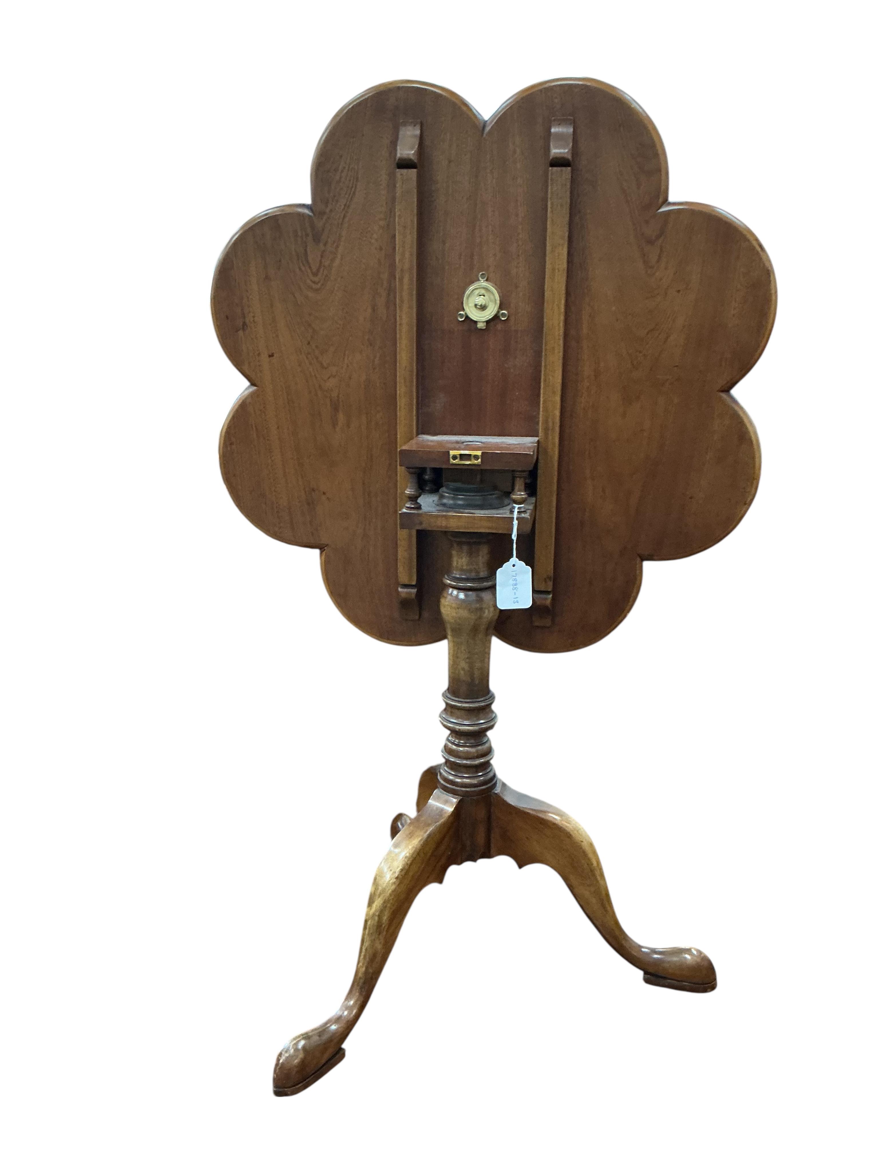 A reproduction mahogany tilt top tripod tea table, diameter 67cm, height 66cm